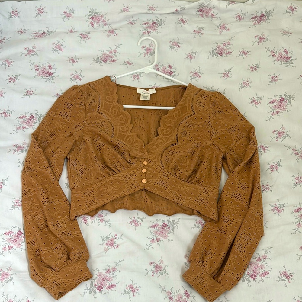 Cropped, brown top.